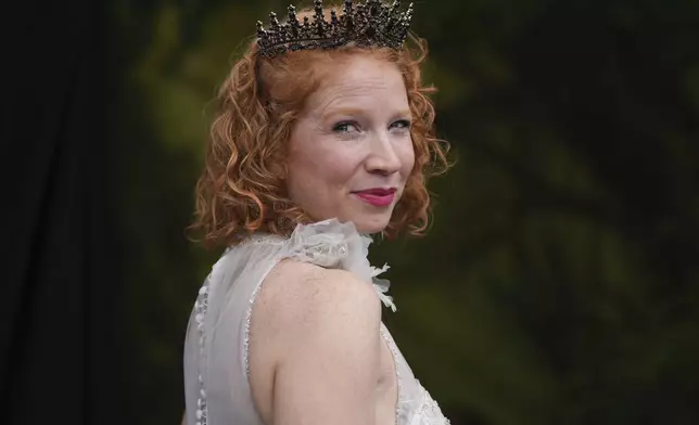 A participant poses with a crown during the Red Head Days festival in Tilburg, Netherlands, Saturday, Aug. 30, 2025. (AP Photo/Virginia Mayo)