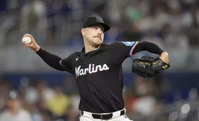 Miami Marlins starting pitcher Janson Junk (26) pitches during the first inning of a baseball game against the New York Yankees, Friday, Aug. 1, 2025, in Miami. (AP Photo/Rebecca Blackwell)