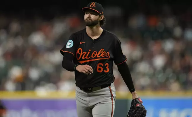 Baltimore Orioles starting pitcher Brandon Young returns to the dugout after the eighth inning of a baseball game against the Houston Astros in Houston, Friday, Aug. 15, 2025. (AP Photo/Ashley Landis)