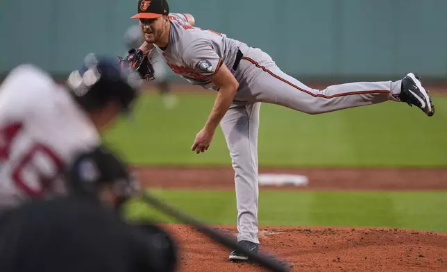 Baltimore Orioles pitcher Trevor Rogers delivers during the first inning of a baseball game against the Boston Red Sox at Fenway Park, Monday, Aug. 18, 2025, in Boston. (AP Photo/Charles Krupa)
