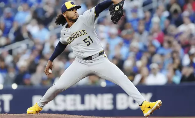 Milwaukee Brewers pitcher Freddy Peralta (51) works against the Toronto Blue Jays during first inning MLB baseball action in Toronto on Friday, August 29, 2025. (Chris Young/The Canadian Press via AP)