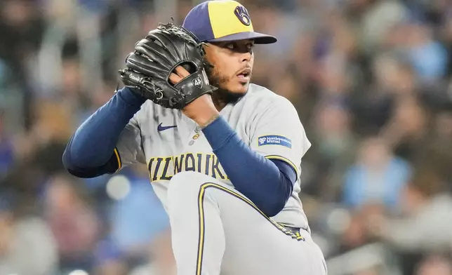 Milwaukee Brewers pitcher Freddy Peralta (51) works against the Toronto Blue Jays during the sixth inning of a baseball game in Toronto on Friday, Aug. 29, 2025. (Chris Young/The Canadian Press via AP)