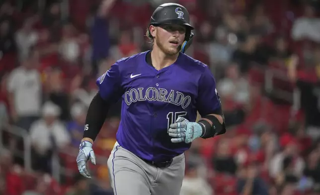 Colorado Rockies' Hunter Goodman rounds the bases after hitting a two-run home run during the fourth inning of a baseball game against the St. Louis Cardinals Tuesday, Aug. 12, 2025, in St. Louis. (AP Photo/Jeff Roberson)
