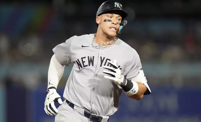 New York Yankees' Aaron Judge runs the bases after his solo home run off Tampa Bay Rays pitcher Shane Baz during the first inning of a baseball game Tuesday, Aug. 19, 2025, in Tampa, Fla. (AP Photo/Chris O'Meara)