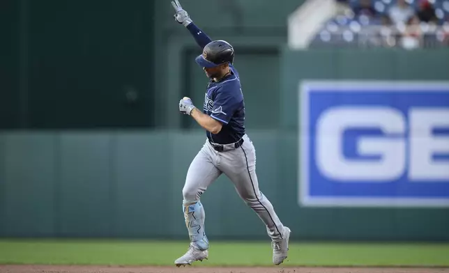 Tampa Bay Rays' Brandon Lowe gestures as he celebrates his two-home run while rounding the bases in the first inning of a baseball game against the Washington Nationals, Friday, Aug. 29, 2025, in Washington. (AP Photo/Nick Wass)