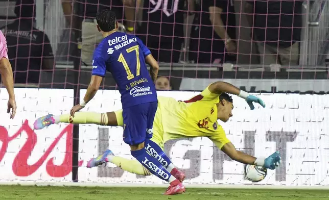 Pumas UNAM midfielder Jorge Ruvalcaba (17), right, scores a goal against Inter Miami goalkeeper Rocco Ríos Novo (34) during the first half of a Leagues Cup soccer match, Wednesday, Aug. 6, 2025, in Fort Lauderdale, Fla. (AP Photo/Lynne Sladky)