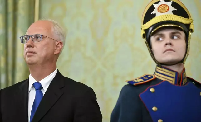 Russian Direct Investment Fund CEO Kirill Dmitriev, left, attends a meeting between Russian President Vladimir Putin and United Arab Emirates President Sheikh Mohammed bin Zayed Al Nahyan at the Grand Kremlin Palace in Moscow, Russia, Thursday, Aug. 7, 2025. (Alexander Nemenov/Pool Photo via AP)