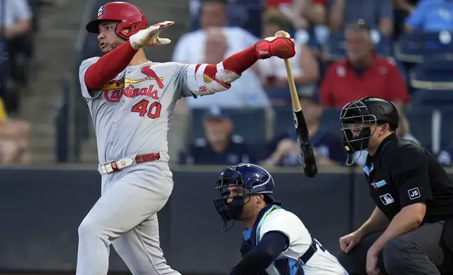 St. Louis Cardinals' Willson Contreras (40) follows through on a single off Tampa Bay Rays pitcher Joe Boyle during the first inning of a baseball game Thursday, Aug. 21, 2025, in Tampa, Fla. (AP Photo/Chris O'Meara)