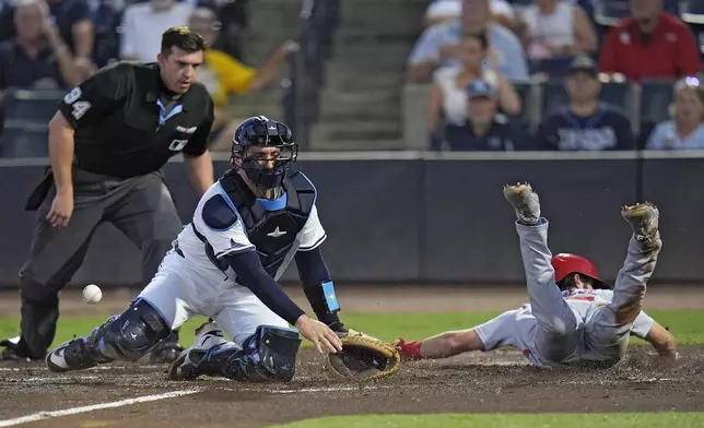 St. Louis Cardinals' Thomas Saggese, right, scores as the throw skips away from Tampa Bay Rays catcher Nick Fortes on a fielder's choice by Nathan Church during the second inning of a baseball game Thursday, Aug. 21, 2025, in Tampa, Fla. (AP Photo/Chris O'Meara)