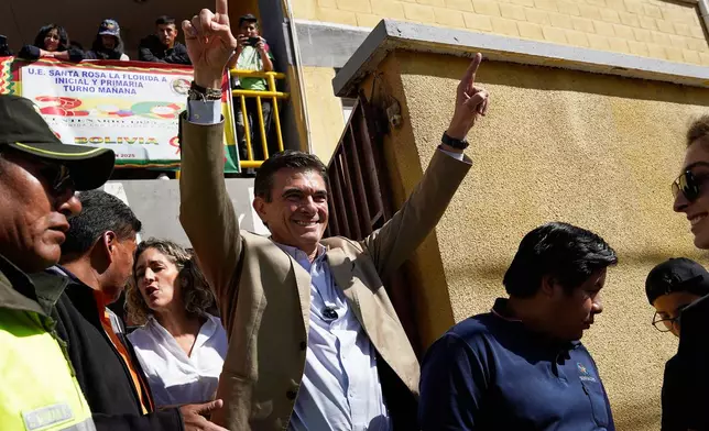 Presidential candidate Rodrigo Paz leaves after accompanying his daughter Catalina to vote during general elections, in La Paz, Bolivia, Sunday, Aug. 17, 2025. (AP Photo/Freddy Barragan)