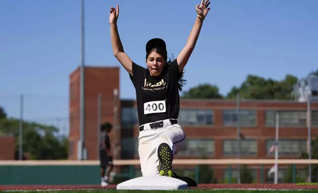 Shalvah Lazarus slides to third base during the first day of tryouts for the Women's Professional Baseball League, Friday, Aug 22, 2025, at the Washington Nationals Youth Baseball Academy in Washington. (AP Photo/Julia Demaree Nikhinson)