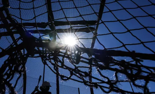 A player swings during the first day of tryouts for the Women's Professional Baseball League, Friday, Aug 22, 2025, at the Washington Nationals Youth Baseball Academy in Washington. (AP Photo/Julia Demaree Nikhinson)