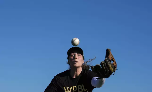 Laurie Kehr attempts to catch a ball during an outfielder drill on the second day of tryouts for the Women's Professional Baseball League, Saturday, Aug 23, 2025, at the Washington Nationals Youth Baseball Academy in Washington. (AP Photo/Julia Demaree Nikhinson)
