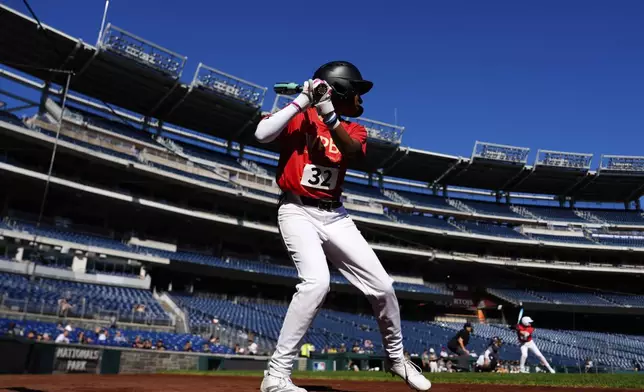 Mo'ne Davis warms up during the fourth day of tryouts for the Women's Professional Baseball League, Monday, Aug. 25, 2025, at Nationals Park in Washington. (AP Photo/Julia Demaree Nikhinson)