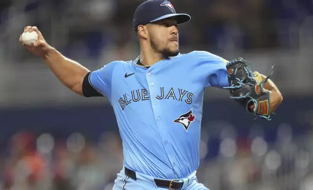Toronto Blue Jays starting pitcher Jose Berrios throws during the first inning of a baseball game against the Miami Marlins, Saturday, Aug. 23, 2025, in Miami. (AP Photo/Jim Rassol)