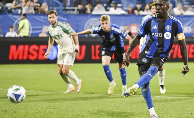 CF Montreal's Prince Owusu, right, scores from the penalty spot during second-half MLS soccer match action against Austin FC in Montreal, Saturday, Aug. 23, 2025. (Graham Hughes/The Canadian Press via AP)