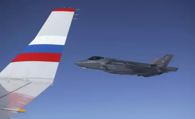 F-35 fighter escorts a Ilyushin Il-96-300 aircraft of the Russia Special Flight Squadron carrying Russian President Vladimir Putin back to Russia after his meeting with US President Donald Trump on Friday, Aug. 15, 2025, at Joint Base Elmendorf-Richardson, Alaska. (Gavriil Grigorov, Sputnik, Kremlin Pool Photo via AP)