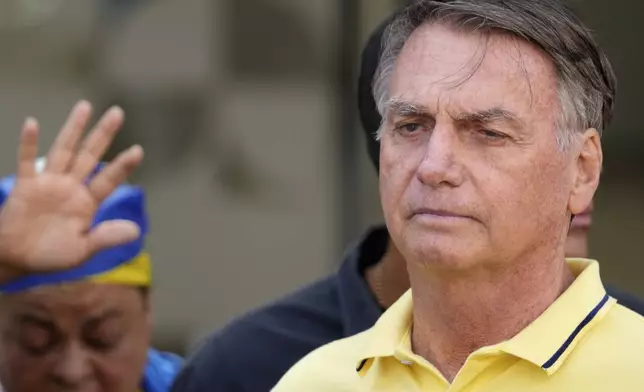 Brazil’s former President Jair Bolsonaro, temporarily allowed out of house arrest for medical exams, leaves a hospital in Brasília, Brazil, Saturday, Aug. 16, 2025. (AP Photo/Eraldo Peres)