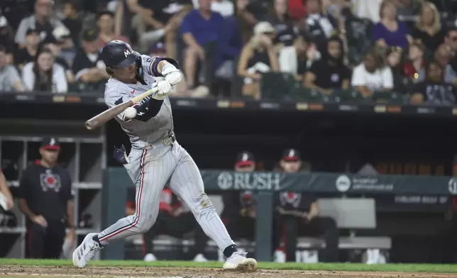 Minnesota Twins' Luke Keaschall singles against the Chicago White Sox during the sixth inning of a baseball game, Friday, Aug. 22, 2025, in Chicago. (AP Photo/Talia Sprague)