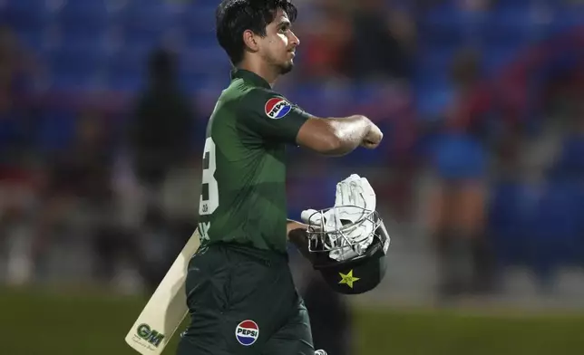 Pakistan's Saim Ayub walks off after being caught out off the bowling of West Indies' Jason Holder during the third Twenty20 cricket match Sunday, Aug. 3, 2025, in Lauderhill, Fla. (AP Photo/Lynne Sladky)