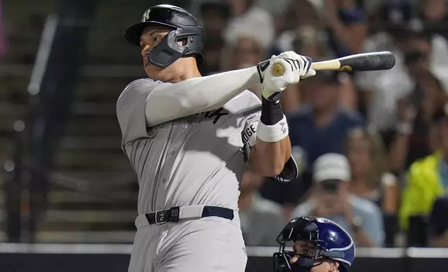 New York Yankees' Aaron Judge watches his solo home run off Tampa Bay Rays pitcher Shane Baz during the first inning of a baseball game Tuesday, Aug. 19, 2025, in Tampa, Fla. (AP Photo/Chris O'Meara)