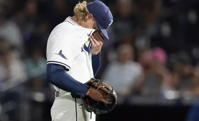 Tampa Bay Rays pitcher Shane Baz reacts after giving up three home runs to the New York Yankees during the first inning of a baseball game Tuesday, Aug. 19, 2025, in Tampa, Fla. (AP Photo/Chris O'Meara)