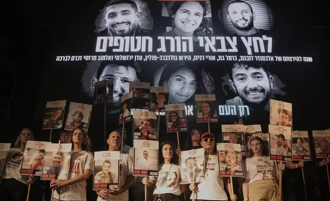 Relatives and supporters of hostages held by Hamas take part in a rally demanding their immediate release and calling for an end of the war in the Gaza Strip, at a plaza known as hostages square in Tel Aviv, Israel, Saturday, Aug. 30, 2025. (AP Photo/Mahmoud Illean)