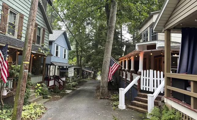 Cottages in the town of Mount Gretna, Pa., shown Wednesday, Aug. 6, 2025, spring to life every summer with people who spend their leisure time engaged in activities such as cooking lessons, nature walks, yoga, professorial lectures, music and plays. (AP Photo/Mark Scolforo)
