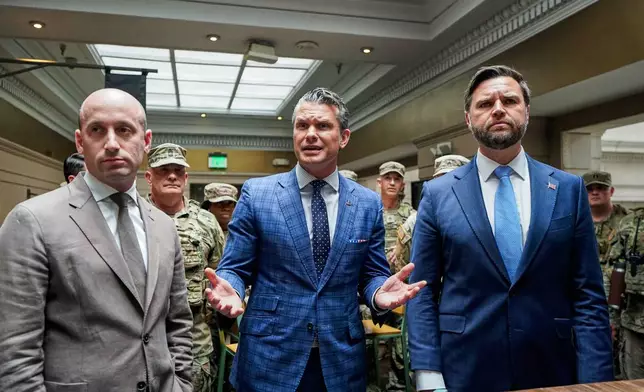 White House Deputy Chief of Staff Stephen Miller, Defense Secretary Pete Hegseth and Vice President JD Vance, greet members of the National Guard at Union Station in Washington, Wednesday, Aug. 20, 2025. (Al Drago/Pool via AP)