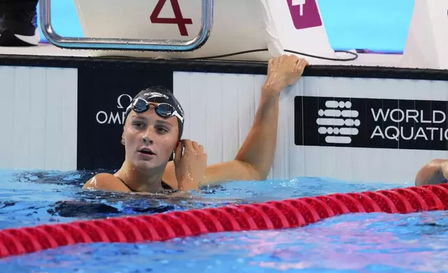 Summer McIntosh of Canada reacts during the women's 800-meter freestyle heats at the World Aquatics Championships in Singapore, Friday, Aug.1, 2025. (AP Photo/Vincent Thian)