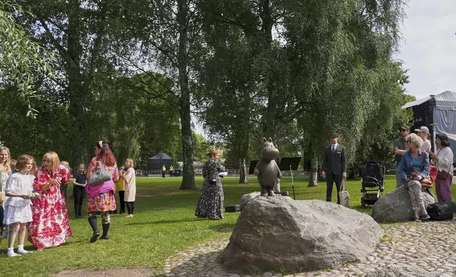 Finland Moomins Fans celebrate the 80th anniversary of the publication of the Finnish children's classic, "The Moomins and The Great Flood," and the birthday of the author Tove Jansson, in Tampere, Finland, Saturday, Aug. 9, 2025. (AP Photo/Tommi Ojala)