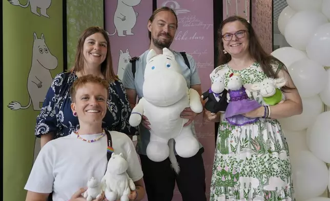 Finland Moomins Fans celebrate the 80th anniversary of the publication of the Finnish children's classic, "The Moomins and The Great Flood," and the birthday of the author Tove Jansson, in Tampere, Finland, Saturday, Aug. 9, 2025. (AP Photo/Tommi Ojala)