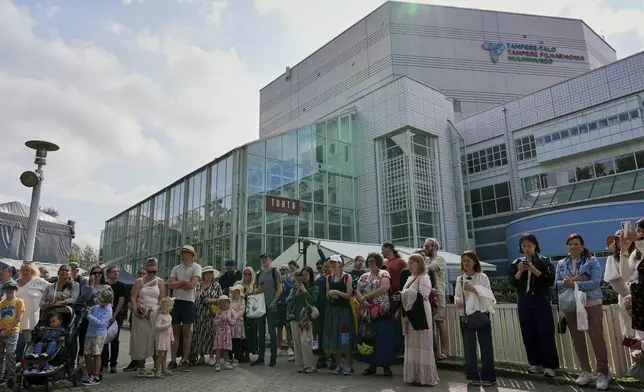 Finland Moomins Fans celebrate the 80th anniversary of the publication of the Finnish children's classic, "The Moomins and The Great Flood," and the birthday of the author Tove Jansson, in Tampere, Finland, Saturday, Aug. 9, 2025. (AP Photo/Tommi Ojala)