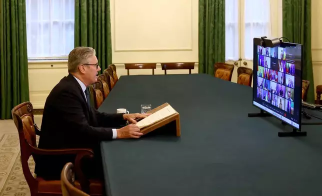 Britain's Prime Minister Keir Starmer co-chairs a videoconference call with European leaders on Ukraine, in London, Wednesday, Aug. 13, 2025. (Jack Taylor/Pool Photo via AP)
