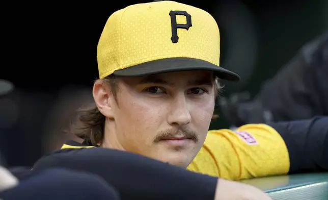 Pittsburgh Pirates pitcher Bubba Chandler stands in the dugout before a baseball game against the Colorado Rockies, Friday, Aug. 22, 2025, in Pittsburgh. (AP Photo/Matt Freed)