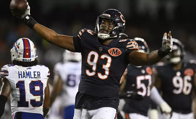 Chicago Bears defensive end Xavier Carlton (93) celebrates after recovering a Buffalo Bills fumble in the second half of a preseason NFL football game Sunday, Aug. 17, 2025, in Chicago. (AP Photo/Paul Beaty)