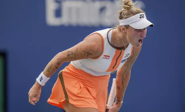 Marketa Vondrousova, of the Czech Republic, reacts after a rally against Jasmine Paolini, of Italy, during the third round of the U.S. Open tennis championships, Friday, Aug. 29, 2025, in New York. (AP Photo/Seth Wenig)