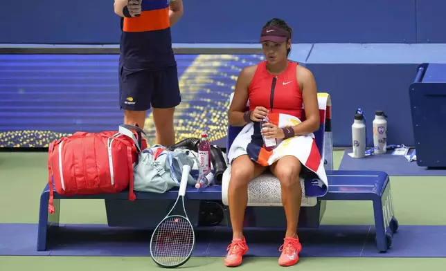 Emma Raducanu, of Great Britain, takes a break between games against Elena Rybakina, of Kazakhstan, during the third round of the U.S. Open tennis championships, Friday, Aug. 29, 2025, in New York. (AP Photo/Kirsty Wigglesworth)