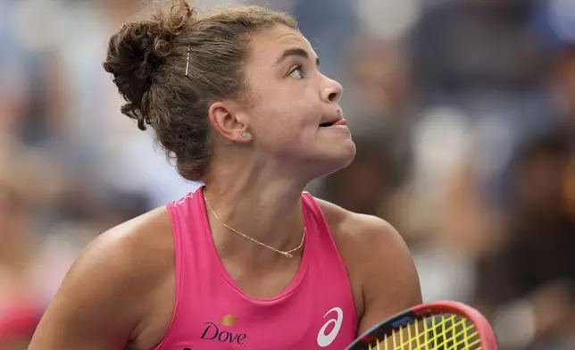 Jasmine Paolini, of Italy, reacts after a rally with Marketa Vondrousova, of the Czech Republic, during the third round of the U.S. Open tennis championships, Friday, Aug. 29, 2025, in New York. (AP Photo/Seth Wenig)
