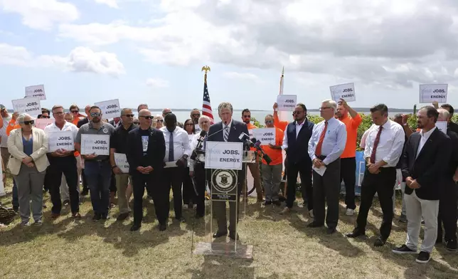 Rhode Island Gov. Dan McKee talks about the importance of the Revolution Wind offshore wind farm to the state's economy and energy future during a news conference in North Kingstown, R.I., on Monday, Aug. 25, 2025. (AP Photo/Jennifer McDermott)