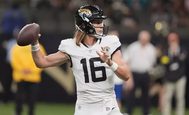 Jacksonville Jaguars quarterback Trevor Lawrence throws a pass against the New Orleans Saints in the first half of an NFL preseason football game in New Orleans, Sunday, Aug. 17, 2025. (AP Photo/Gerald Herbert)