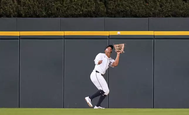 Detroit Tigers center fielder Wenceel Perez catches a fly out by Houston Astros' Jeremy Pena during the sixth inning of a baseball game, Tuesday, Aug. 19, 2025, in Detroit. (AP Photo/Ryan Sun)