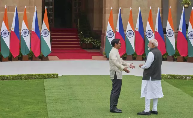 Indian Prime Minister Narendra Modi, right, talks with Philippines President Ferdinand Marcos Jr. before their delegation level talks in New Delhi, India, Tuesday, Aug. 5, 2025. (AP Photo/Manish Swarup)