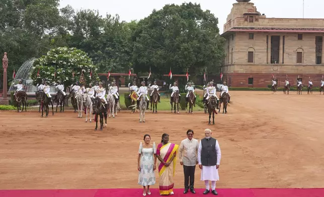 From right, Indian Prime Minister Narendra Modi, left, visiting Philippines President Ferdinand Marcos Jr., Indian President Droupadi Murmu, and Philippines first lady Louise Marcos, pose for photographs during a ceremonial reception at the Indian presidential palace in New Delhi, India, Tuesday, Aug. 5, 2025. (AP Photo/Manish Swarup)
