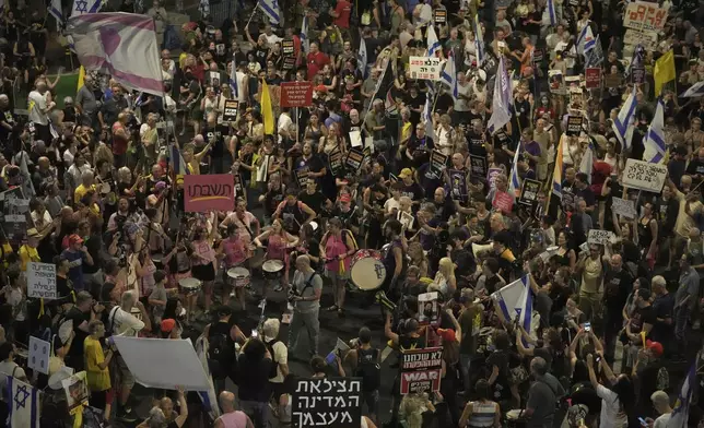 People take part in a protest demanding the end of the war, the immediate release of hostages held by Hamas in the Gaza Strip, and against Prime Minister Benjamin Netanyahu's government in Tel Aviv, Saturday, Aug. 16, 2025. (AP Photo/Mahmoud Illean)