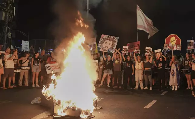 People take part in a protest demanding the end of the war, the immediate release of hostages held by Hamas in the Gaza Strip, and against Prime Minister Benjamin Netanyahu's government in Tel Aviv, Israel, Saturday, Aug. 16, 2025. (AP Photo/Mahmoud Illean)