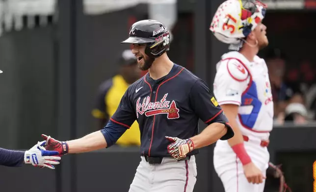Atlanta Braves' Eli White celebrates his home run against the Cincinnati Reds during the second inning of the MLB Speedway Classic baseball game at Bristol Motor Speedway in Bristol, Tenn., Sunday, Aug. 3, 2025. Play was resumed today after yesterday's weather delay. (AP Photo/George Walker IV)