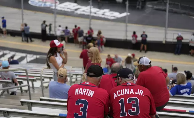 Fans gather for the MLB Speedway Classic baseball game at Bristol Motor Speedway in Bristol, Tenn., Sunday, Aug. 3, 2025. Play was resumed today after yesterday's weather delay. (AP Photo/George Walker IV)