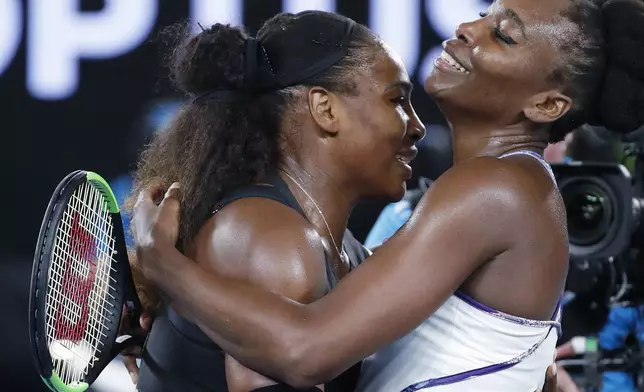 FILE - United States' Serena Williams, left, embraces her sister, Venus, as she celebrates after winning the women's singles final at the Australian Open tennis championships in Melbourne, Australia, Saturday, Jan. 28, 2017. (AP Photo/Dita Alangkara, File)