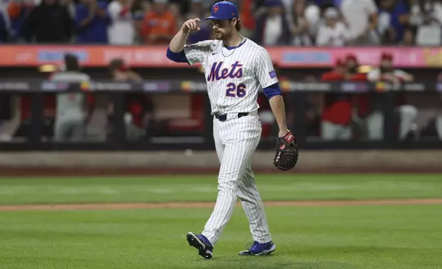 New York Mets pitcher Nolan McLean walks to the dugout during the seventh inning of a baseball game against the Philadelphia Phillies, Wednesday, Aug. 27, 2025, in New York. (AP Photo/Pamela Smith)
